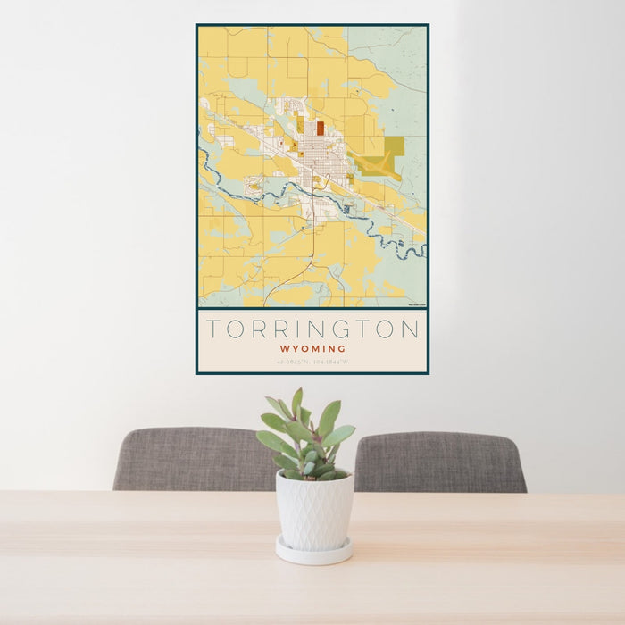 24x36 Torrington Wyoming Map Print Portrait Orientation in Woodblock Style Behind 2 Chairs Table and Potted Plant