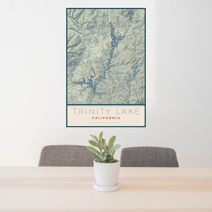 24x36 Trinity Lake California Map Print Portrait Orientation in Woodblock Style Behind 2 Chairs Table and Potted Plant