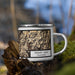 Right View Custom Trinity Lake California Map Enamel Mug in Ember on Grass With Trees in Background