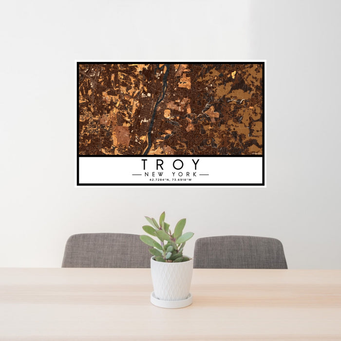 24x36 Troy New York Map Print Lanscape Orientation in Ember Style Behind 2 Chairs Table and Potted Plant