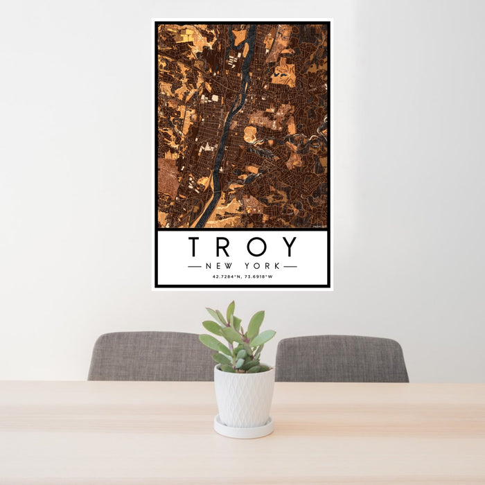 24x36 Troy New York Map Print Portrait Orientation in Ember Style Behind 2 Chairs Table and Potted Plant