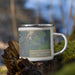 Right View Custom Truth or Consequences New Mexico Map Enamel Mug in Afternoon on Grass With Trees in Background