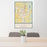 24x36 Tupelo Mississippi Map Print Portrait Orientation in Woodblock Style Behind 2 Chairs Table and Potted Plant