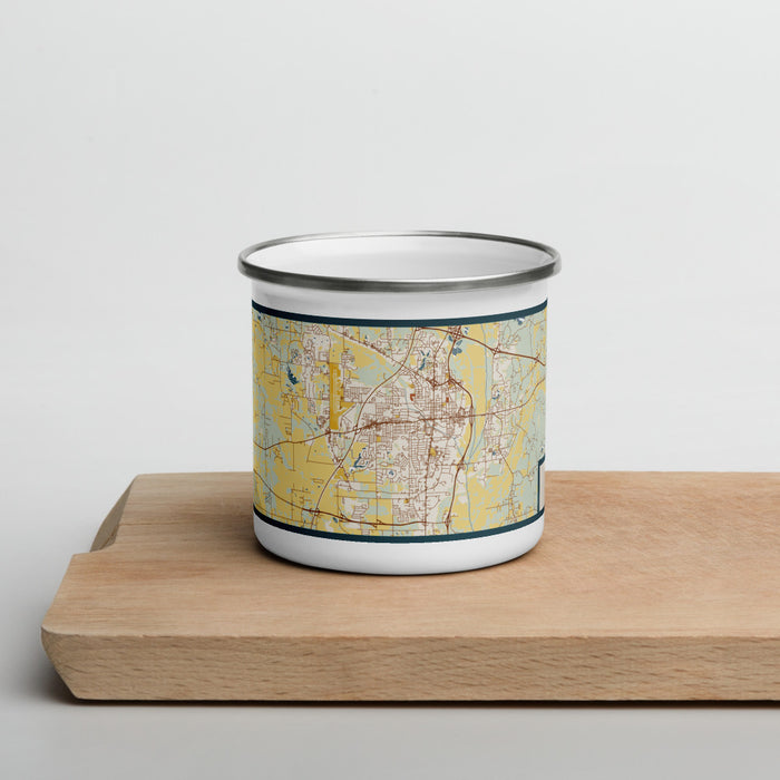 Front View Custom Tupelo Mississippi Map Enamel Mug in Woodblock on Cutting Board