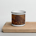 Front View Custom Ulysses Kansas Map Enamel Mug in Ember on Cutting Board