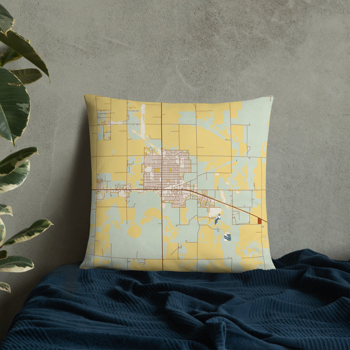 Custom Ulysses Kansas Map Throw Pillow in Woodblock on Bedding Against Wall