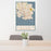 24x36 Victoria British Columbia Map Print Portrait Orientation in Woodblock Style Behind 2 Chairs Table and Potted Plant
