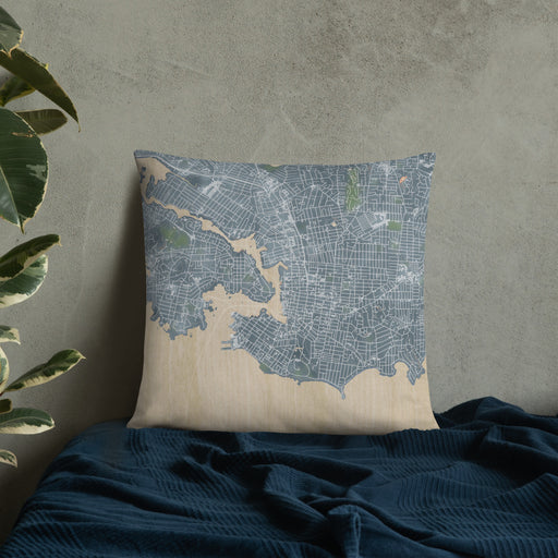 Custom Victoria British Columbia Map Throw Pillow in Afternoon on Bedding Against Wall