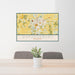 24x36 Warrensburg Missouri Map Print Lanscape Orientation in Woodblock Style Behind 2 Chairs Table and Potted Plant