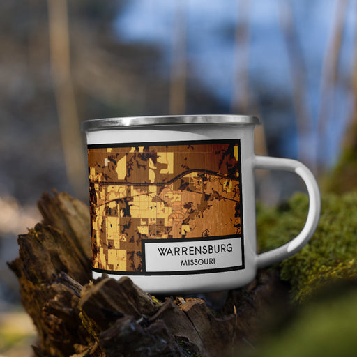Right View Custom Warrensburg Missouri Map Enamel Mug in Ember on Grass With Trees in Background