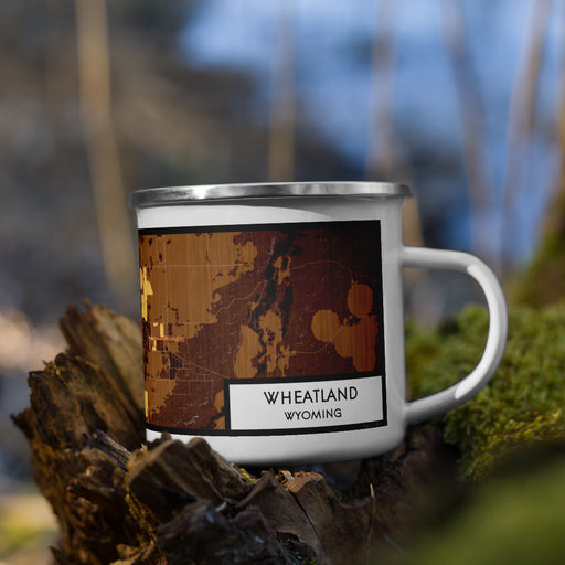 Right View Custom Wheatland Wyoming Map Enamel Mug in Ember on Grass With Trees in Background