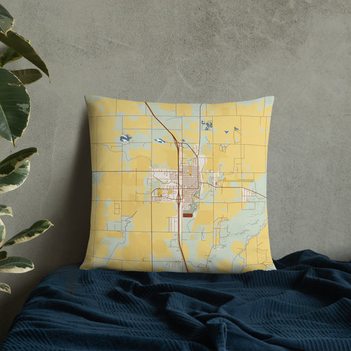 Custom Wheatland Wyoming Map Throw Pillow in Woodblock on Bedding Against Wall