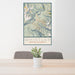24x36 Whistler British Columbia Map Print Portrait Orientation in Woodblock Style Behind 2 Chairs Table and Potted Plant