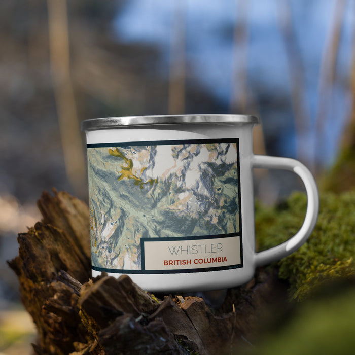 Right View Custom Whistler British Columbia Map Enamel Mug in Woodblock on Grass With Trees in Background