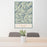 24x36 Whitefish Mountain Montana Map Print Portrait Orientation in Woodblock Style Behind 2 Chairs Table and Potted Plant
