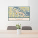 24x36 Winona Minnesota Map Print Lanscape Orientation in Woodblock Style Behind 2 Chairs Table and Potted Plant