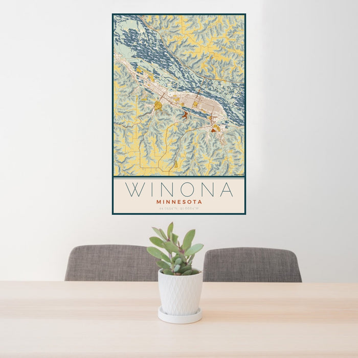 24x36 Winona Minnesota Map Print Portrait Orientation in Woodblock Style Behind 2 Chairs Table and Potted Plant