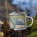 Right View Custom Winona Minnesota Map Enamel Mug in Woodblock on Grass With Trees in Background