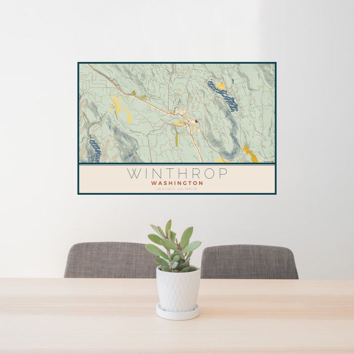 24x36 Winthrop Washington Map Print Lanscape Orientation in Woodblock Style Behind 2 Chairs Table and Potted Plant