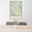 24x36 Winthrop Washington Map Print Portrait Orientation in Woodblock Style Behind 2 Chairs Table and Potted Plant