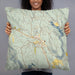 Person holding 22x22 Custom Winthrop Washington Map Throw Pillow in Woodblock