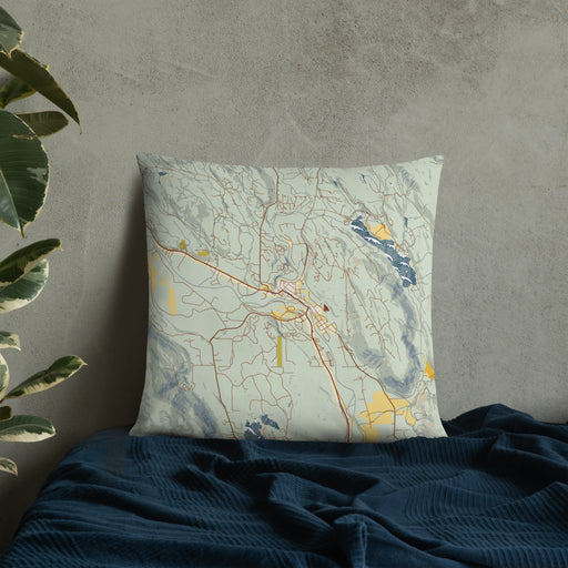 Custom Winthrop Washington Map Throw Pillow in Woodblock on Bedding Against Wall