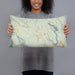 Person holding 20x12 Custom Winthrop Washington Map Throw Pillow in Woodblock