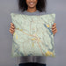 Person holding 18x18 Custom Winthrop Washington Map Throw Pillow in Woodblock