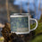 Right View Custom Wisconsin Dells Wisconsin Map Enamel Mug in Afternoon on Grass With Trees in Background