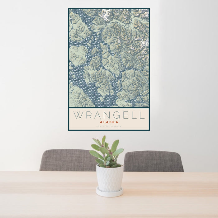 24x36 Wrangell Alaska Map Print Portrait Orientation in Woodblock Style Behind 2 Chairs Table and Potted Plant