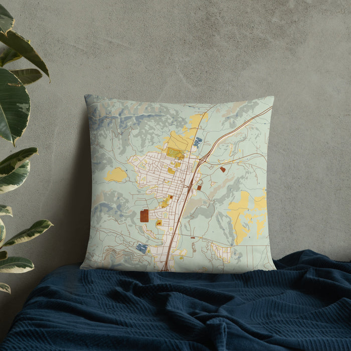 Custom Yreka California Map Throw Pillow in Woodblock on Bedding Against Wall
