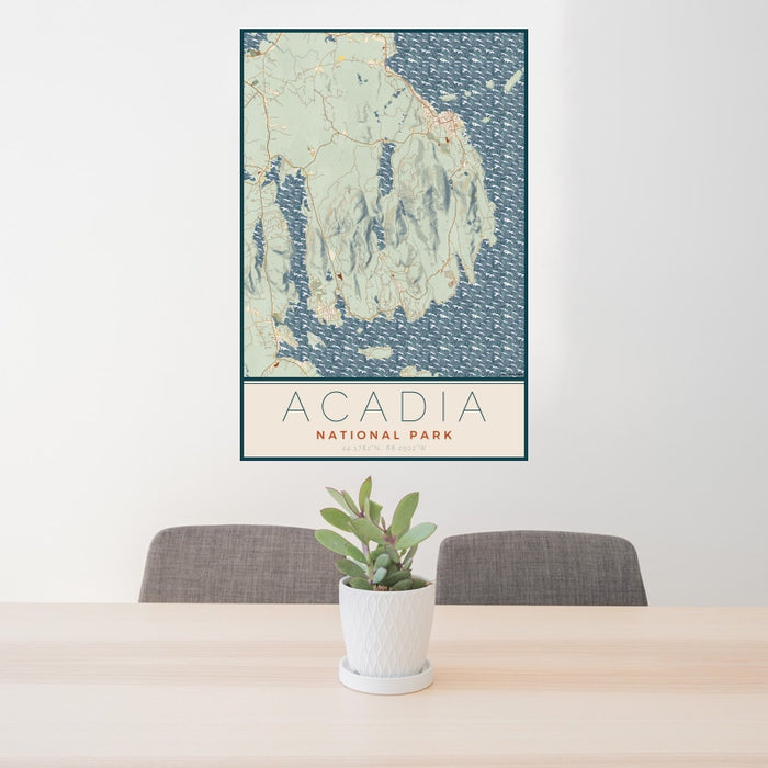 24x36 Acadia National Park Map Print Portrait Orientation in Woodblock Style Behind 2 Chairs Table and Potted Plant