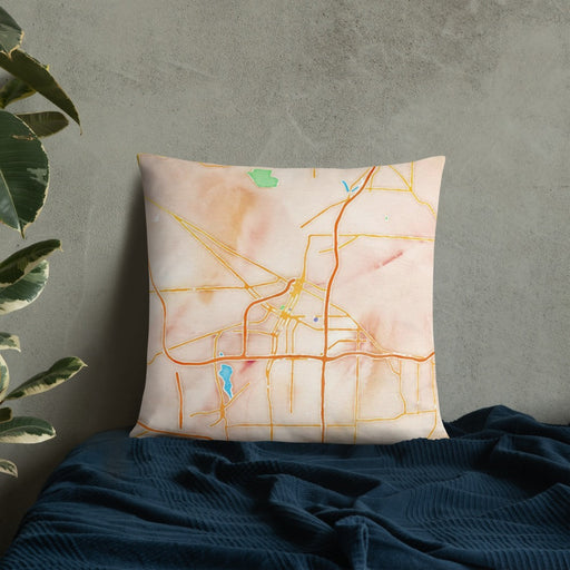 Custom Akron Ohio Map Throw Pillow in Watercolor on Bedding Against Wall
