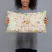 Person holding 20x12 Custom Akron Ohio Map Throw Pillow in Woodblock