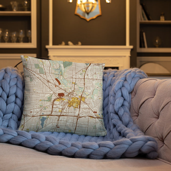 Custom Akron Ohio Map Throw Pillow in Woodblock on Cream Colored Couch