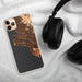 Custom Alameda California Map Phone Case in Ember on Table with Black Headphones
