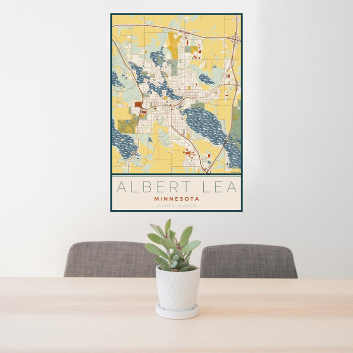 24x36 Albert Lea Minnesota Map Print Portrait Orientation in Woodblock Style Behind 2 Chairs Table and Potted Plant
