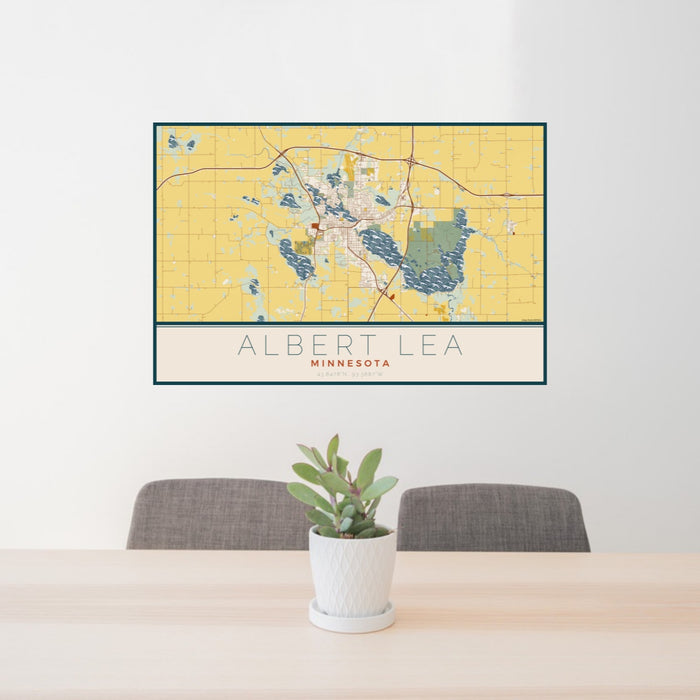 24x36 Albert Lea Minnesota Map Print Landscape Orientation in Woodblock Style Behind 2 Chairs Table and Potted Plant
