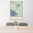 24x36 Alcova Wyoming Map Print Portrait Orientation in Woodblock Style Behind 2 Chairs Table and Potted Plant