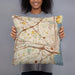 Person holding 18x18 Custom Alexandria Virginia Map Throw Pillow in Woodblock
