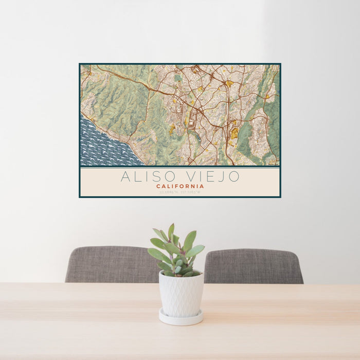 24x36 Aliso Viejo California Map Print Lanscape Orientation in Woodblock Style Behind 2 Chairs Table and Potted Plant