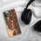 Custom Aliso Viejo California Map Phone Case in Ember on Table with Black Headphones
