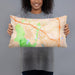 Person holding 20x12 Custom Aliso Viejo California Map Throw Pillow in Watercolor