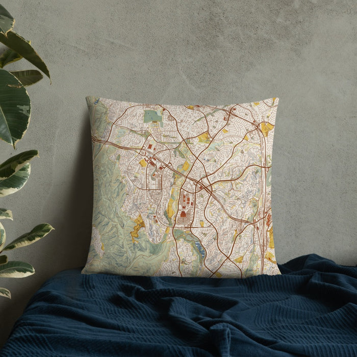 Custom Aliso Viejo California Map Throw Pillow in Woodblock on Bedding Against Wall