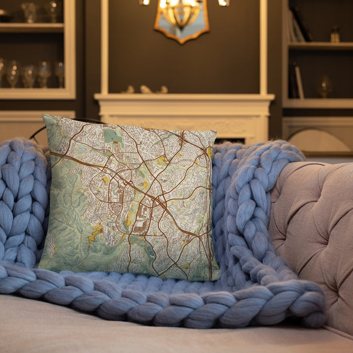 Custom Aliso Viejo California Map Throw Pillow in Woodblock on Cream Colored Couch