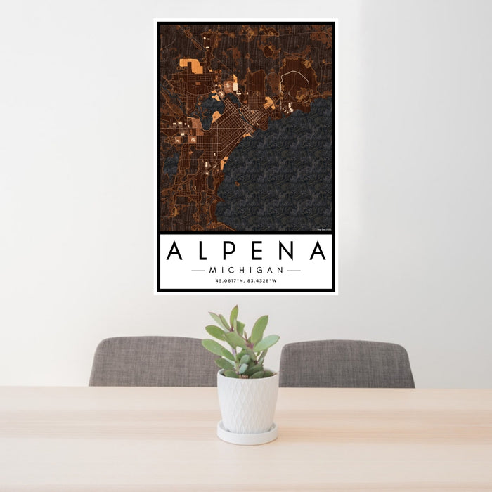 24x36 Alpena Michigan Map Print Portrait Orientation in Ember Style Behind 2 Chairs Table and Potted Plant