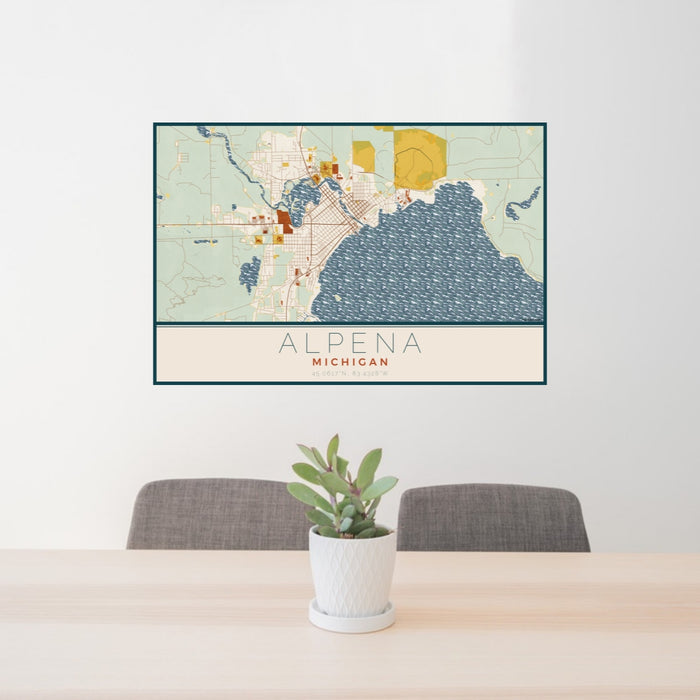 24x36 Alpena Michigan Map Print Lanscape Orientation in Woodblock Style Behind 2 Chairs Table and Potted Plant