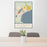 24x36 Alpena Michigan Map Print Portrait Orientation in Woodblock Style Behind 2 Chairs Table and Potted Plant