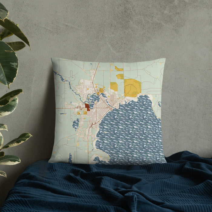 Custom Alpena Michigan Map Throw Pillow in Woodblock on Bedding Against Wall