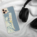 Custom Amelia Island Florida Map Phone Case in Woodblock on Table with Black Headphones